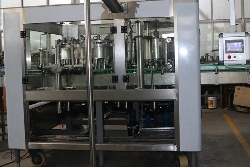 Automated bottle filling machine on a factory floor