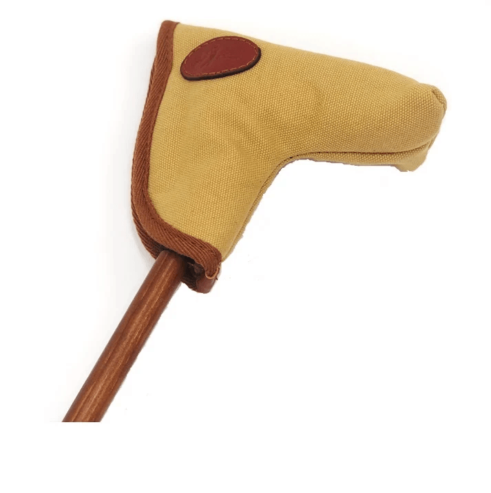 Tan canvas putter headcover with a leather patch on a wooden shaft