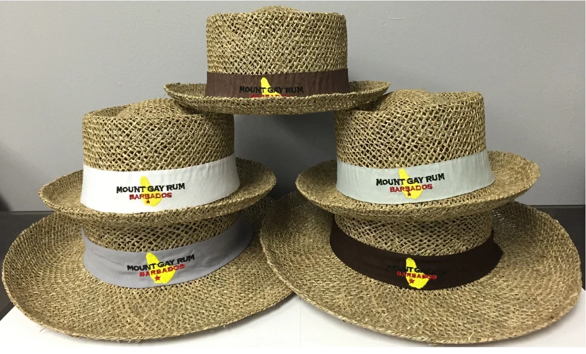 Five Mount Gay Rum Barbados straw hats stacked together